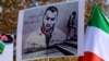 Protesters hold placards bearing portraits of then-detained Iranian rapper Toomaj Salehi and portraits of children (left) who were killed during the protests in Iran. (file photo)