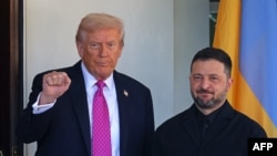 US President Donald Trump gestures as he greets Ukrainian President Volodymyr Zelensky at the White House in Washington, DC, on October 17. 