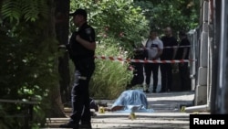 The body of Andriy Parubiy, who was killed this morning, lies on the ground in Lviv.