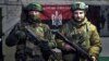 Украинские военнослужащие позируют для фото в укрытии Донецкой области, 21 февраля 2023 года
