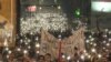 Protesters In Belgrade Light Up Night Sky During Moment Of Silence grab