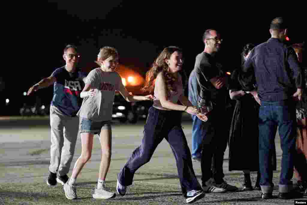 Kurmasheva's family race to greet her as she disembarked the plane on August 1. 