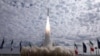 This handout photo provided by Iran's Revolutionary Guards Corps (IRGC) shows the launch of the Qaem-100 satellite launch vehicle. 