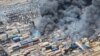 Smoke rises after a massive explosion and fire rocked a port near the southern port city of Bandar Abbas, Iran, on April 26.