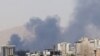 Smoke billows for the second day from the Shahran oil depot, northwest of Tehran, on June 16, 2025.